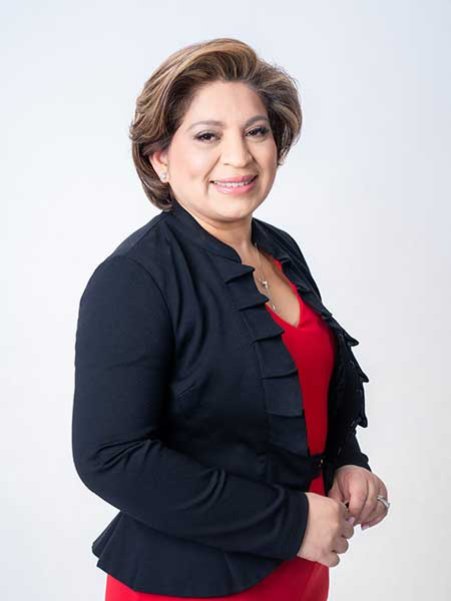 Headshot of Mayor Rocio Treminio-Lopez with black blazer and red blouse, smiling.