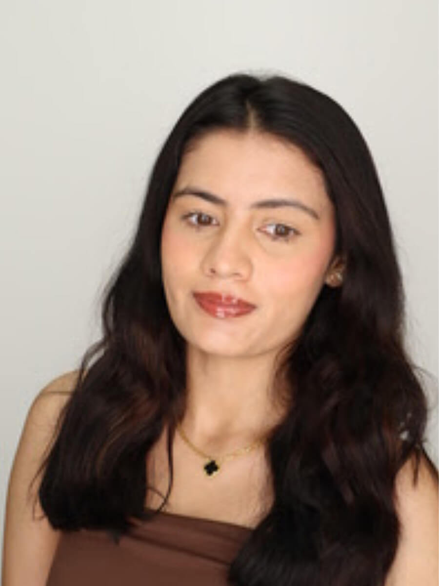 Headshot of student wearing a brown shirt.