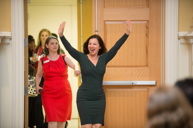 Fran Drescher enters a room at the Do Good Challenge waving