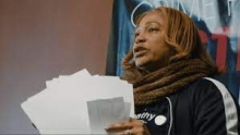 image of a woman holding papers