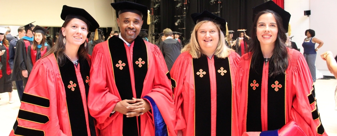 4 phd graduates in regalia