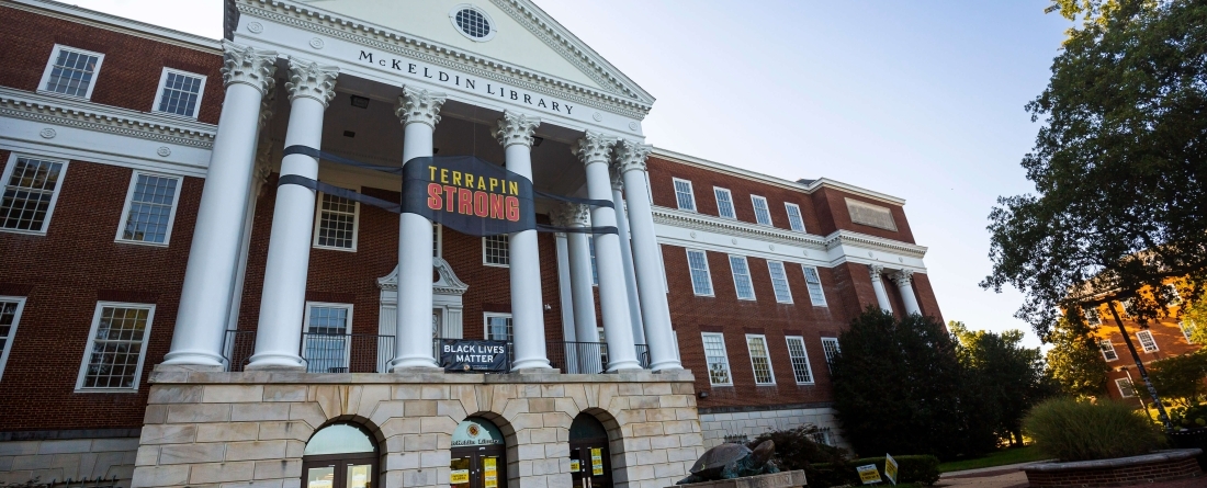 McKeldin library with signs that read "Terrapin Strong" and "Black Lives Matter"