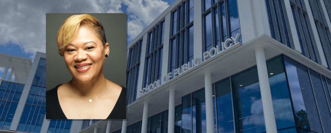 Headshot of Dr. Niambi Carter with a background of the School of Public Plicy