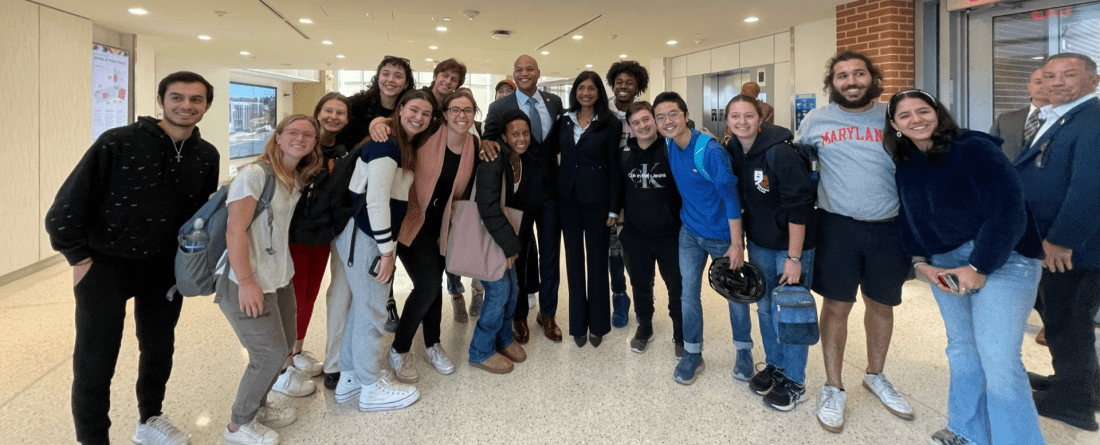 Gov. Elect Wes Moore posing with students