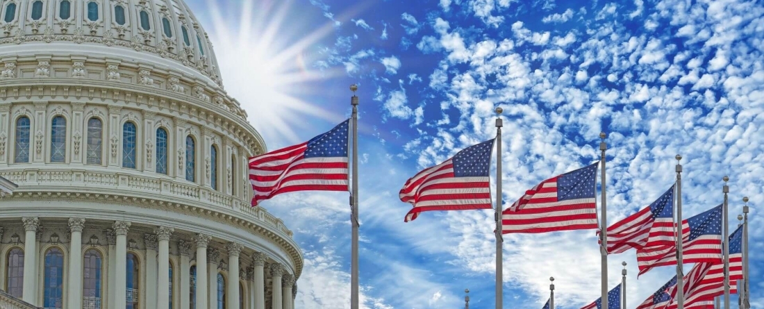 capitol building surrounded by American flags