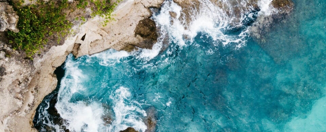 image of the ocean meeting the sand