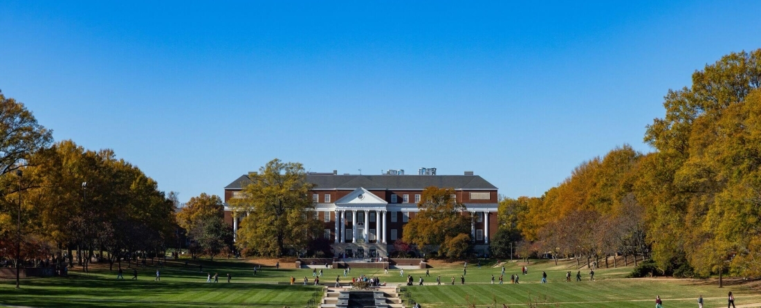McKeldin Mall with a bright grassy field, and McKeldin library in the background.