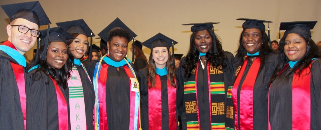 graduate posing at commencement reception