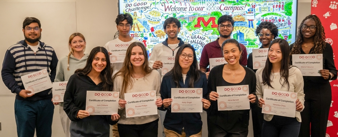 The students from the spring impact bootcamp cohort all posing with their certificates marking their completion of the program.
