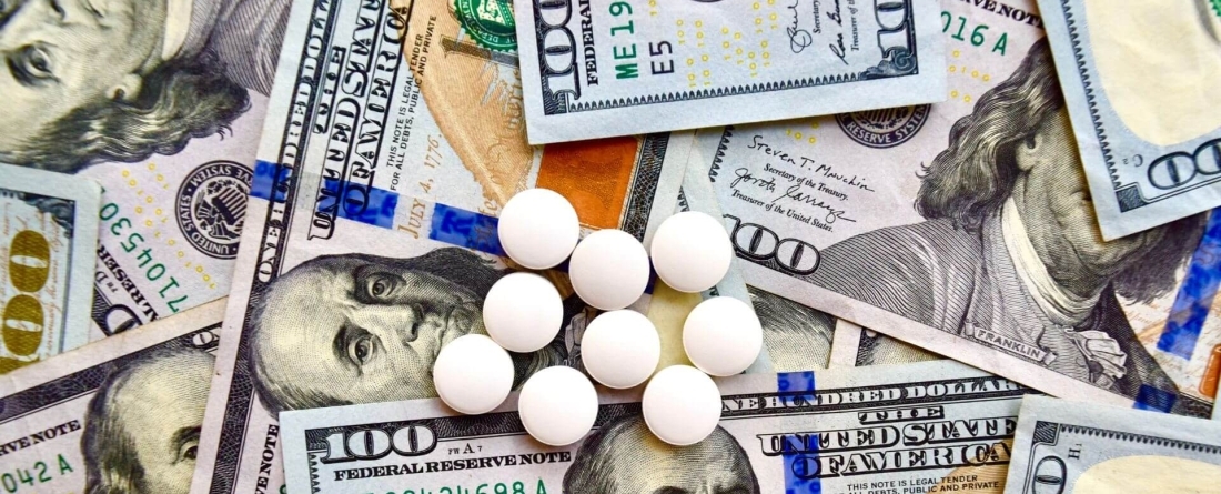 image of pills on money