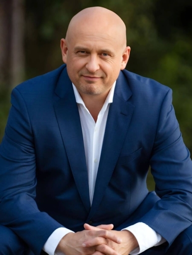 headshot of Phil Johnson; Photo Credit Cheryl Price